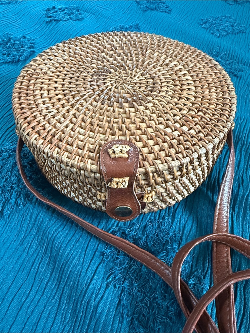 Round Woven Straw Crossbody Bag with Brown Leather Trim